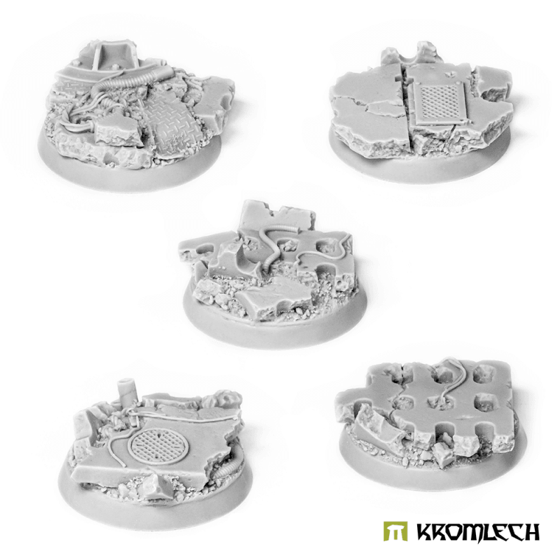 Five Kromlech KRRB013 32mm concrete slab bases in unpainted grey resin showing sculpted urban debris detail