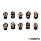 The ten painted heads again from a lower angle, five patterns twice over, cheeks scarred and skulls banded in metal